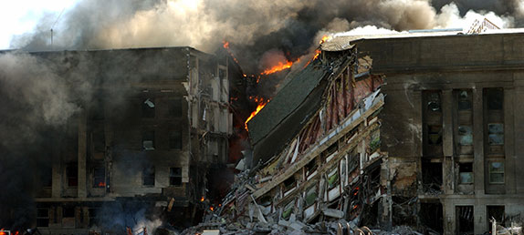 A man stares at the destruction of the World Trade Center at Ground Zero after violent Muslim terrorists on September 11th.